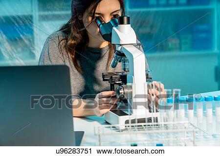 Student using microscope. View Large Photo Image Stock Image - Student using microscope.. Fotosearch