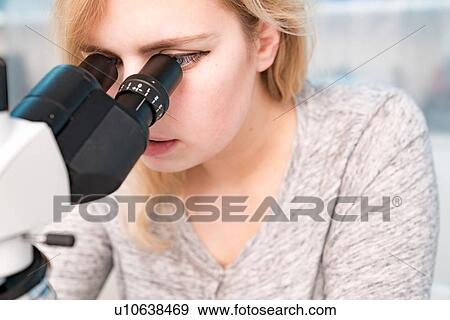 Student using microscope. View Large Photo Image Stock Photo - Student using microscope.. Fotosearch