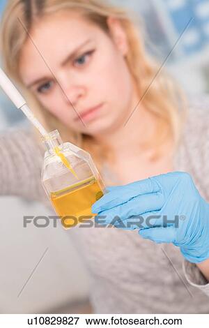 Stock Photo - Student using pipette.. Fotosearch