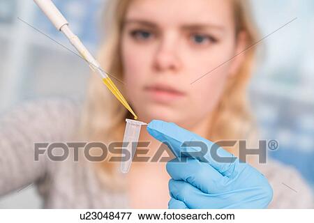 Stock Photo - Student using pipette.. Fotosearch
