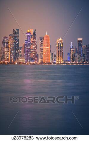 Stock Image - Sunset skyline of Doha, Qatar. Fotosearch