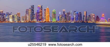 Stock Photo - Sunset skyline of Doha, Qatar. Fotosearch