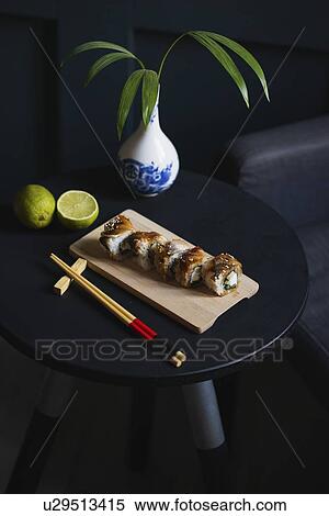Sushi on table with chopsticks, vase and lime View Large Photo Image Stock Photography - Sushi on table with chopsticks, vase and lime. Fotosearch