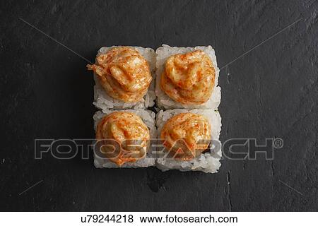 Stock Photo - Sushi with orange sauce. Fotosearch