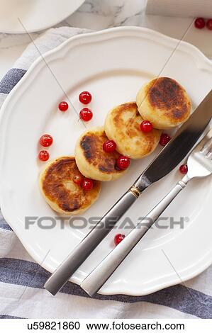 Syrniki with cranberries View Large Photo Image Stock Image - Syrniki with cranberries. Fotosearch