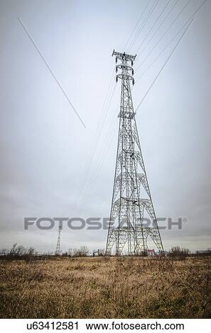 Tall transmission towers carrying power lines across the River Thames, one at each side. Photographed in North Kent, UK. View Large Photo Image Stock Image - Tall transmission towers carrying power lines across the River Thames, one at each side. Photographed in North Kent, UK.. Fotosearch
