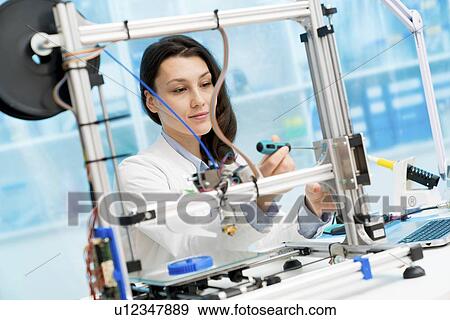 Technician working on 3D printer. View Large Photo Image Stock Photo - Technician working on 3D printer.. Fotosearch