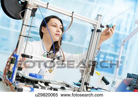 Technician working on 3D printer. View Large Photo Image Stock Photography - Technician working on 3D printer.. Fotosearch