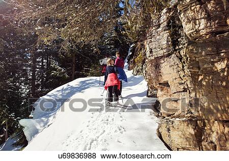 Teenage girl and sisters snowshoeing up snow covered mountainside, Styria, Tyrol, Austria View Large Photo Image Stock Photo - Teenage girl and sisters snowshoeing up snow covered mountainside, Styria, Tyrol, Austria. Fotosearch
