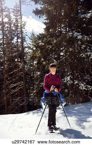 Teenage girl snowshoeing in snow covered mountain forest, portrait, Styria, Tyrol, Austria View Large Photo Image Stock Photo - Teenage girl snowshoeing in snow covered mountain forest, portrait, Styria, Tyrol, Austria. Fotosearch