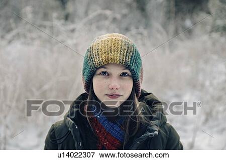 Teenage girl with colorful woollen hat during winter View Large Photo Image Stock Photo - Teenage girl with colorful woollen hat during winter. Fotosearch