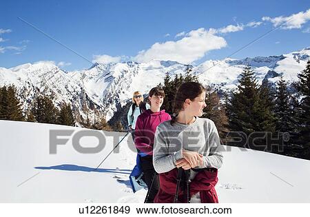 Teenage girl with mother and sisters snowshoeing in snow covered mountain, Styria, Tyrol, Austria View Large Photo Image Stock Photo - Teenage girl with mother and sisters snowshoeing in snow covered mountain, Styria, Tyrol, Austria. Fotosearch