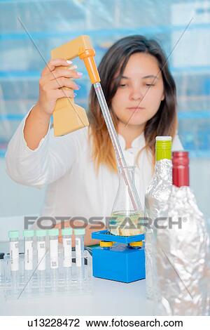 Stock Image - Testing wine in quality control lab.. Fotosearch
