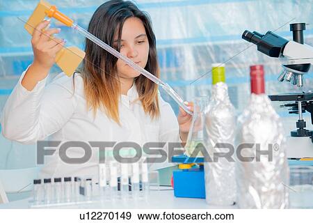 Testing wine in quality control lab. View Large Photo Image Stock Photo - Testing wine in quality control lab.. Fotosearch
