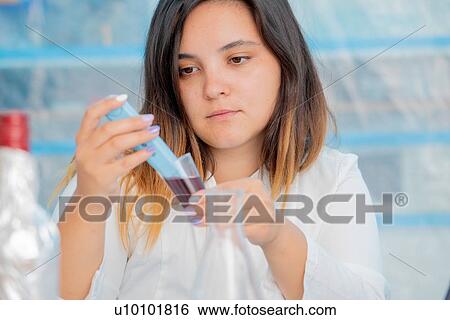 Stock Photograph - Testing wine in quality control lab.. Fotosearch