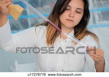 Testing wine in quality control lab. View Large Photo Image Stock Photograph - Testing wine in quality control lab.. Fotosearch