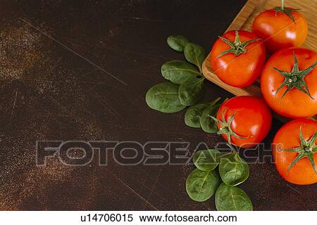 Stock Photography - Tomatoes and basil. Fotosearch