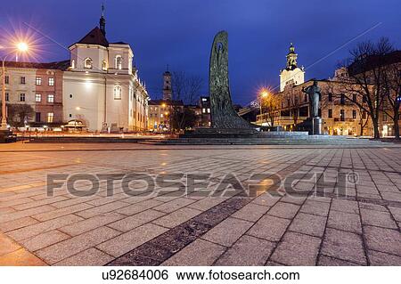 Stock Photograph - Town square at night in Lviv, Ukraine. Fotosearch