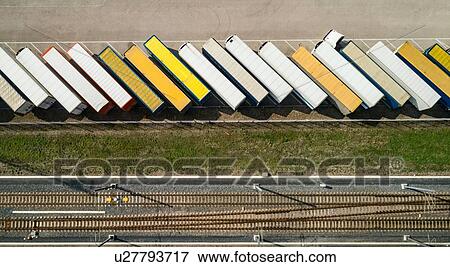 Trailers parked before being loaded onto ferry to UK, overhead view, Hook of Holland, Zuid-Holland, Netherlands View Large Photo Image Stock Photo - Trailers parked before being loaded onto ferry to UK, overhead view, Hook of Holland, Zuid-Holland, Netherlands. Fotosearch