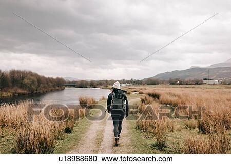 Trekker walking by Loch Lomond, Trossachs National Park, Canada View Large Photo Image Stock Image - Trekker walking by Loch Lomond, Trossachs National Park, Canada. Fotosearch