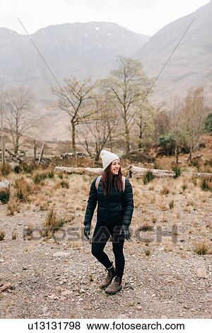 Stock Photo - Trekker walking in Trossachs National Park, Canada. Fotosearch
