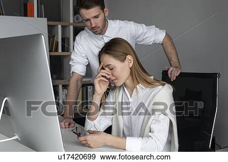 Upset businesswoman and sympathetic colleague View Large Photo Image Stock Photo - Upset businesswoman and sympathetic colleague. Fotosearch