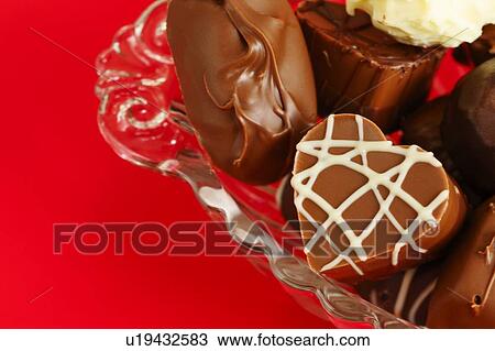 Stock Image - Variety of chocolates on bowl. Fotosearch