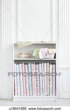 Stock Image - Variety of fabric on shelf. Fotosearch