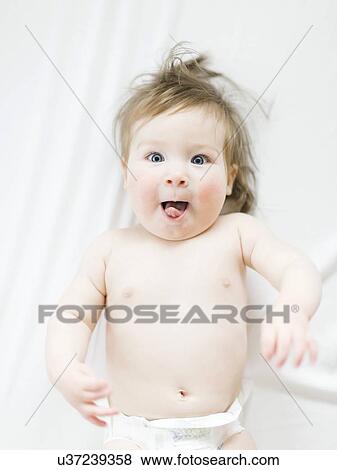 View directly above baby girl pulling face View Large Photo Image Stock Photo - View directly above baby girl pulling face. Fotosearch