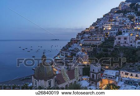 Stock Photo - Village of Positano at sunset on Amalfi Coast, Italy. Fotosearch