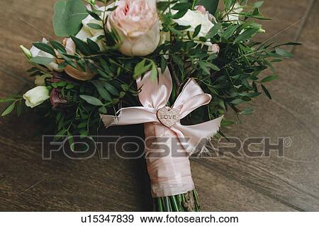 Wedding bouquet tied with pink ribbon View Large Photo Image Stock Photo - Wedding bouquet tied with pink ribbon. Fotosearch