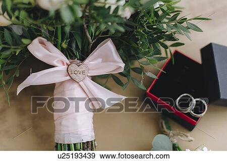 Wedding bouquet tied with pink ribbon View Large Photo Image Stock Photo - Wedding bouquet tied with pink ribbon. Fotosearch