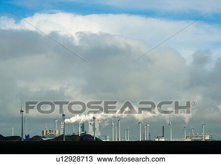 Stock Image - Wind turbines around the Delfzijl harbour area, Delfzijl, Groningen, Netherlands. Fotosearch