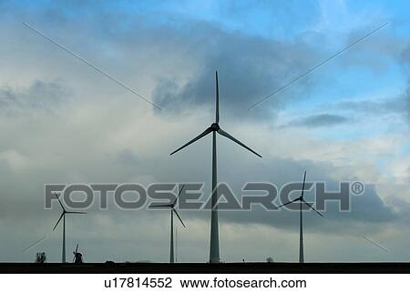 Stock Image - Wind turbines around the Delfzijl harbour area, Delfzijl, Groningen, Netherlands. Fotosearch