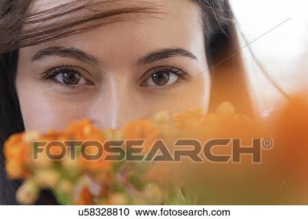 Woman behind flowers View Large Photo Image Stock Image - Woman behind flowers. Fotosearch