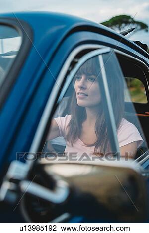 Woman behind steering wheel View Large Photo Image Stock Image - Woman behind steering wheel. Fotosearch