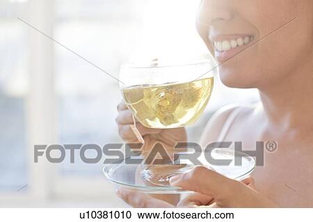 Woman drinking herbal tea. View Large Photo Image Stock Image - Woman drinking herbal tea.. Fotosearch