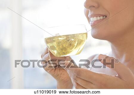 Woman drinking herbal tea. View Large Photo Image Stock Photo - Woman drinking herbal tea.. Fotosearch