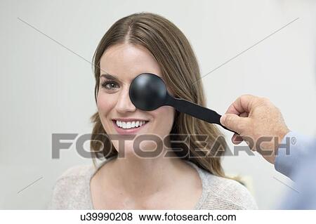 Woman having her eyes tested. View Large Photo Image Stock Photo - Woman having her eyes tested.. Fotosearch