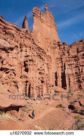 Woman hiking by Fishers Tower in Moab, Utah, USA View Large Photo Image Stock Image - Woman hiking by Fishers Tower in Moab, Utah, USA. Fotosearch