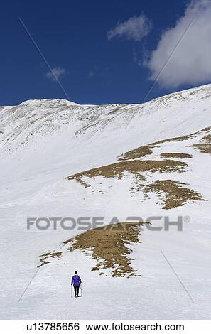 Stock Photograph - Woman hiking on Loveland Pass in Colorado, USA. Fotosearch