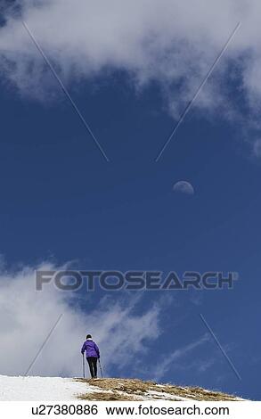 Stock Photograph - Woman hiking on Loveland Pass in Colorado, USA. Fotosearch