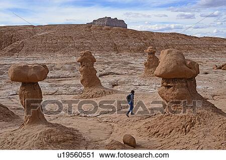 Woman hiking through Goblin Valley State Park, Utah, USA View Large Photo Image Stock Image - Woman hiking through Goblin Valley State Park, Utah, USA. Fotosearch