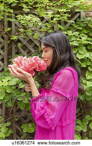 Woman holding bouquet of flowers View Large Photo Image Picture - Woman holding bouquet of flowers. Fotosearch