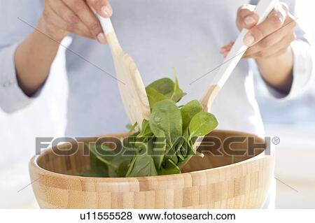 Woman making fresh salad. View Large Photo Image Stock Photo - Woman making fresh salad.. Fotosearch