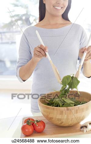 Woman making fresh salad. View Large Photo Image Stock Photo - Woman making fresh salad.. Fotosearch