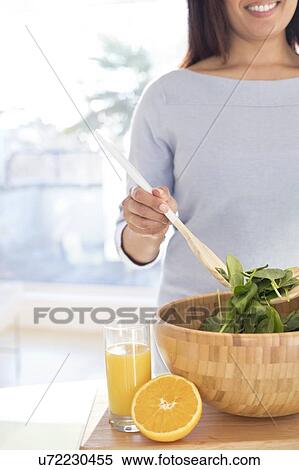 Woman making fresh salad. View Large Photo Image Stock Photography - Woman making fresh salad.. Fotosearch