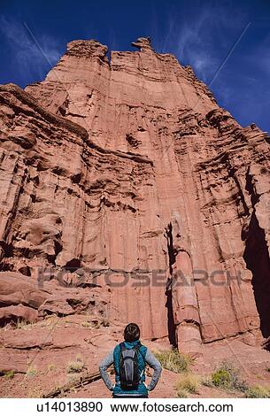 Woman standing by Fisher Towers in Utah, USA View Large Photo Image Stock Image - Woman standing by Fisher Towers in Utah, USA. Fotosearch