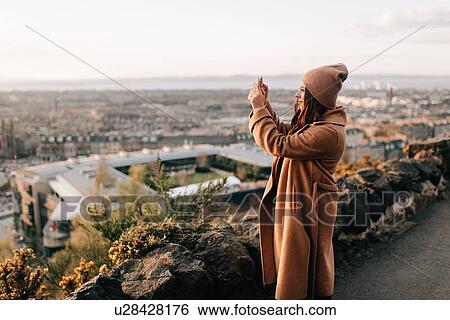 Woman taking photo from Calton Hill, Edinburgh, Scotland View Large Photo Image Stock Photograph - Woman taking photo from Calton Hill, Edinburgh, Scotland. Fotosearch