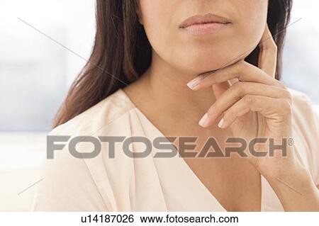 Woman touching chin. View Large Photo Image Stock Photograph - Woman touching chin.. Fotosearch